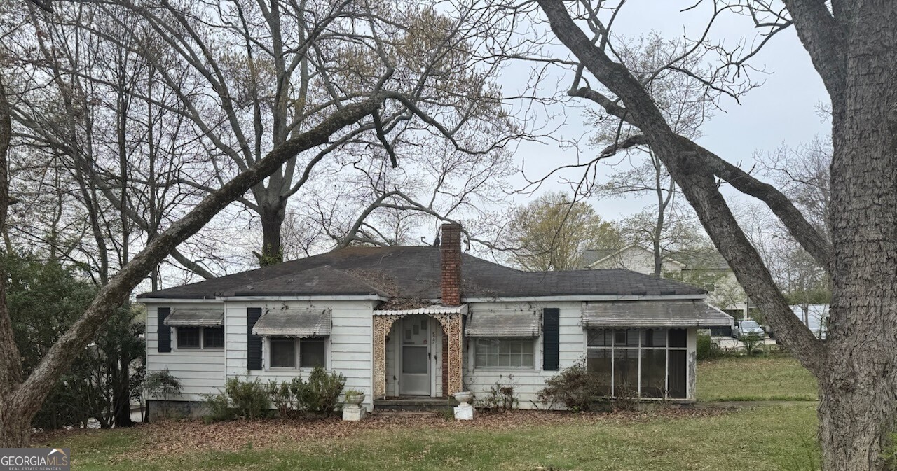 front view of a house with a yard