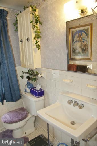 3601 Clifmar Road Windsor Mill, MD 21244 - Photo 14 of 30 a bathroom with a sink toilet and shower