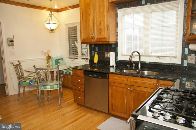3601 Clifmar Road Windsor Mill, MD 21244 - Photo 3 of 30 a kitchen with wooden cabinets stove and sink