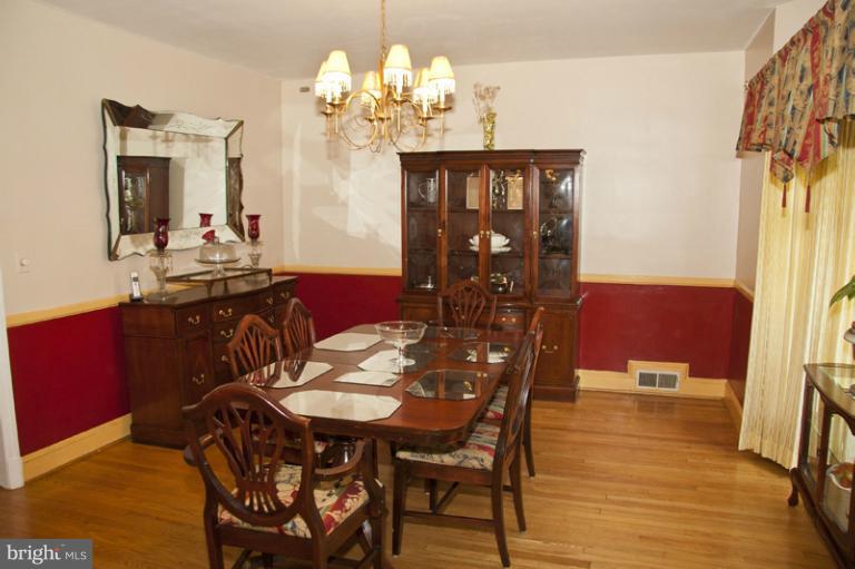 3601 Clifmar Road Windsor Mill, MD 21244 - Photo 4 of 30 a view of a dining room with furniture and chandelier