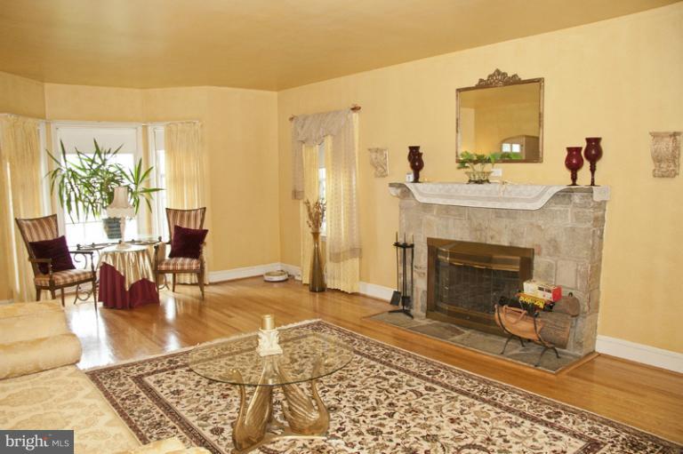 3601 Clifmar Road Windsor Mill, MD 21244 - Photo 8 of 30 a living room with furniture and a fireplace