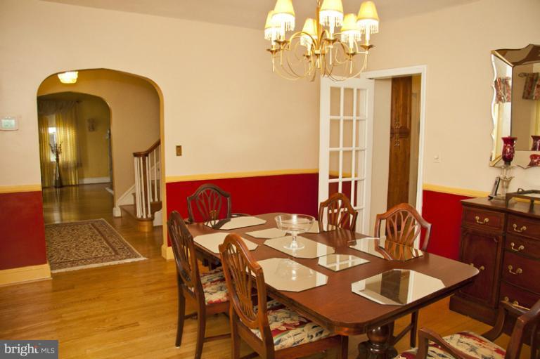 3601 Clifmar Road Windsor Mill, MD 21244 - Photo 10 of 30 a view of a dining room with furniture and chandelier