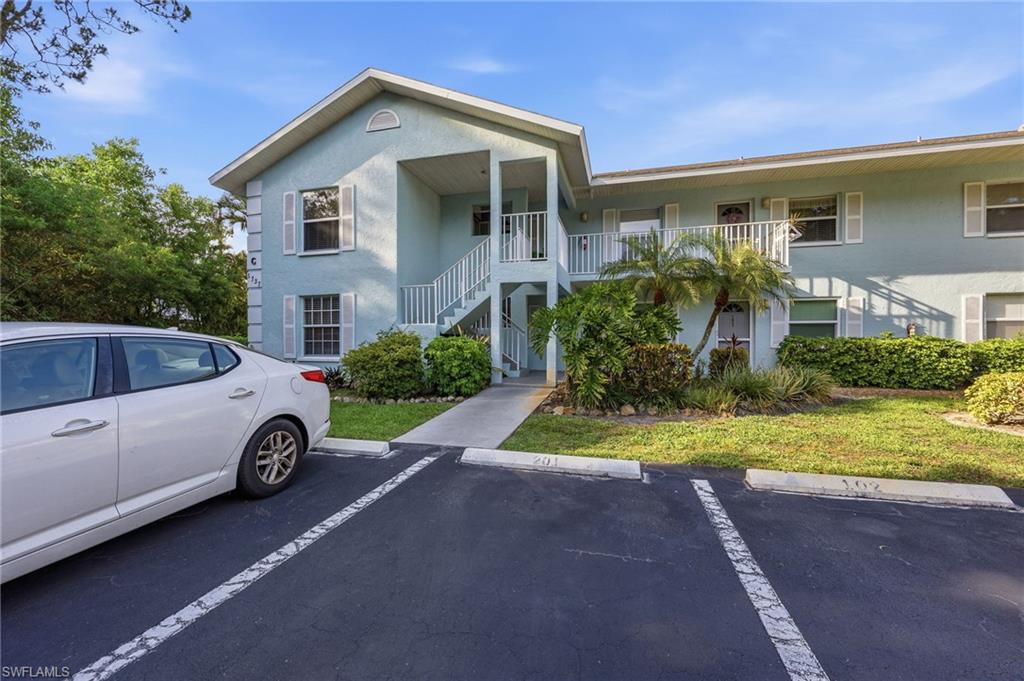 5737 Whitaker Road, Unit C101 Naples, FL 34112 - Photo 20 of 28 a view of outdoor space yard and front view of a house