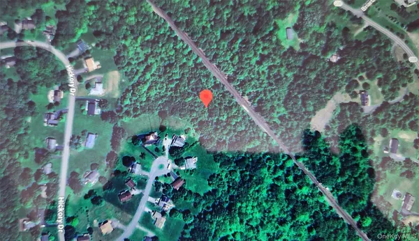 a backyard of a house with lots of green space and a fountain