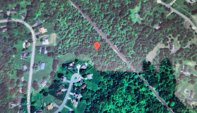 a backyard of a house with lots of green space and a fountain