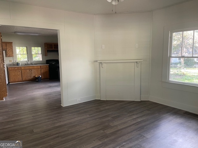 601 Nottingham Street Thomaston, GA 30286 - Photo 5 of 15 an empty room with wooden floor and a window