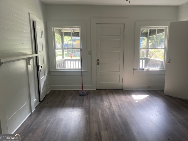 601 Nottingham Street Thomaston, GA 30286 - Photo 9 of 15 an empty room with wooden floor and windows