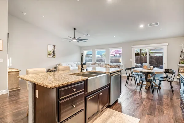 a kitchen with a stove and cabinets