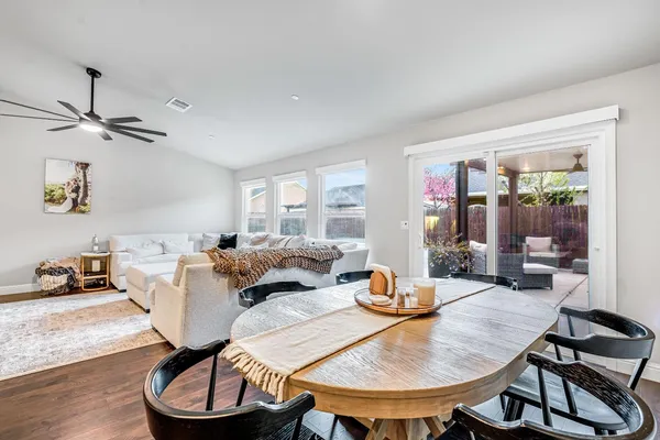 a view of a dining room with furniture window and wooden floor
