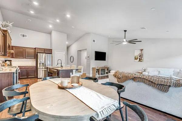 a living room with fireplace furniture and a flat screen tv