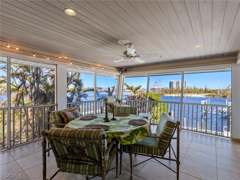 921 Prescott Street Fort Myers Beach, FL 33931 - Photo 14 of 50 a view of a dining room with furniture window and outside view