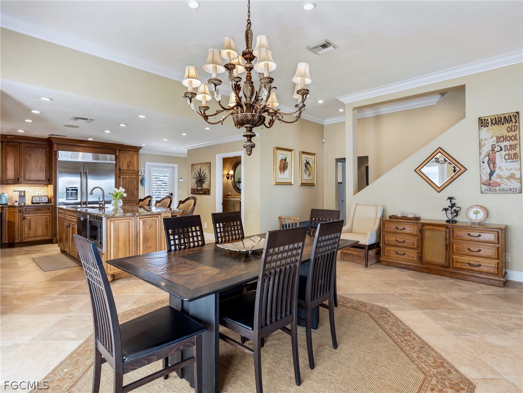 921 Prescott Street Fort Myers Beach, FL 33931 - Photo 15 of 50 a view of a dining room with furniture and wooden floor