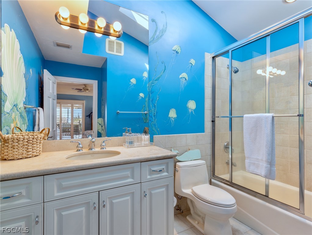 921 Prescott Street Fort Myers Beach, FL 33931 - Photo 19 of 50 a bathroom with a sink shower and a toilet