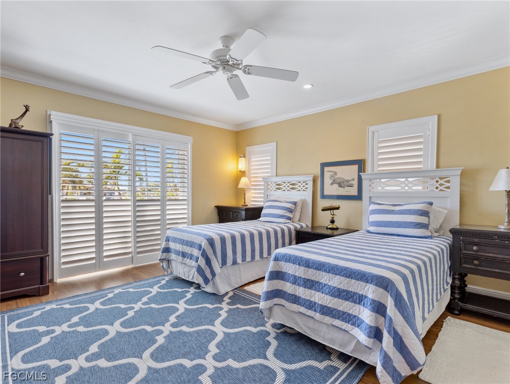 921 Prescott Street Fort Myers Beach, FL 33931 - Photo 20 of 50 a bedroom with two beds and a window