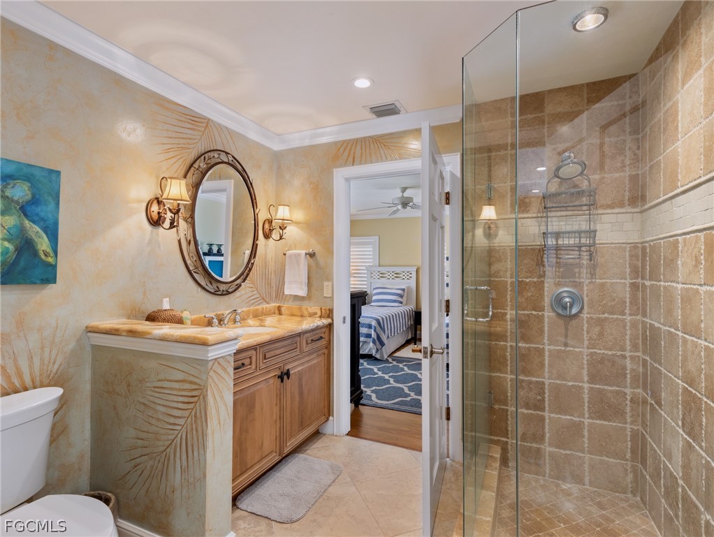 921 Prescott Street Fort Myers Beach, FL 33931 - Photo 21 of 50 a bathroom with a toilet a sink and a shower