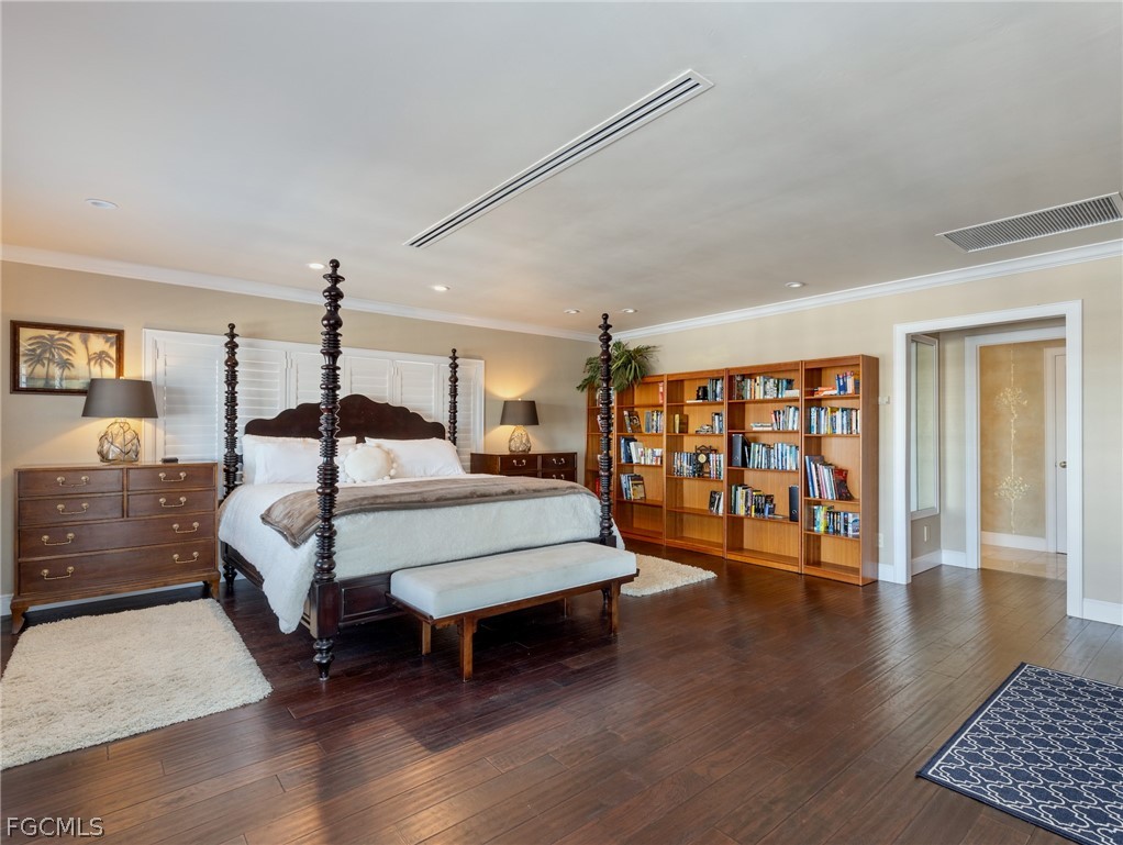 921 Prescott Street Fort Myers Beach, FL 33931 - Photo 22 of 50 a bedroom with a large bed and a table