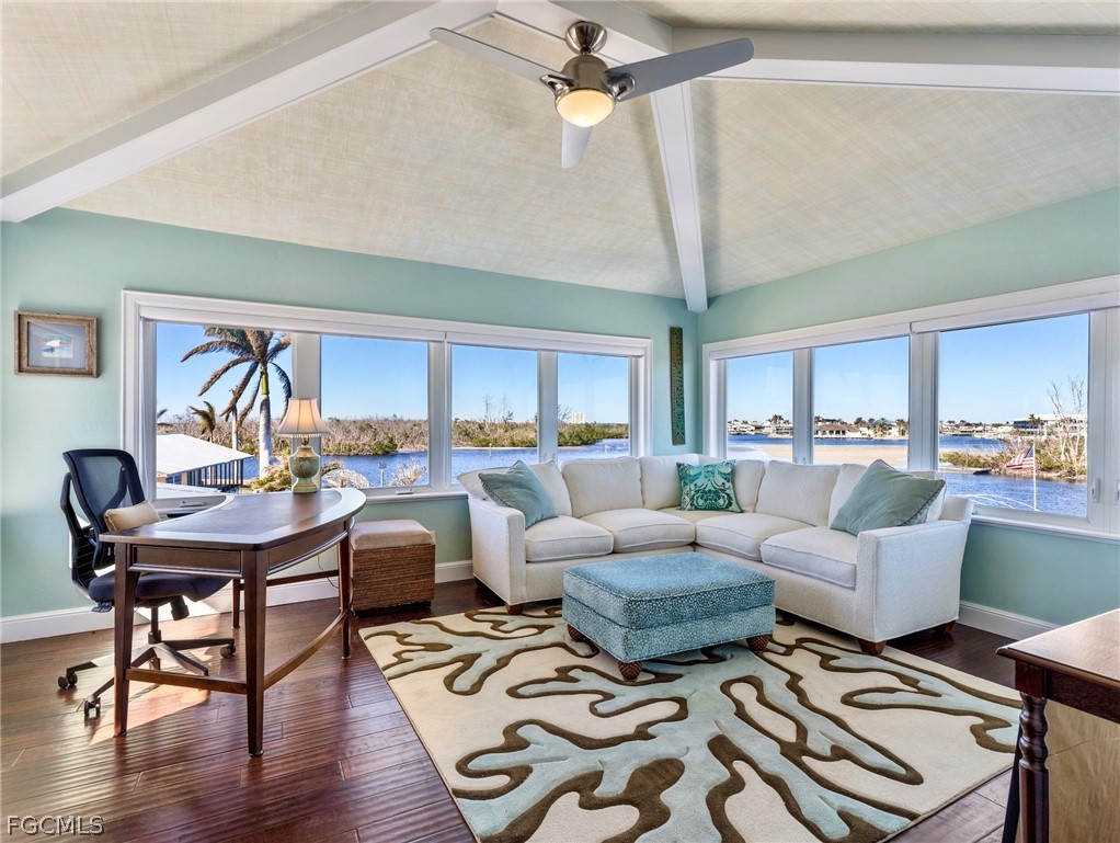 921 Prescott Street Fort Myers Beach, FL 33931 - Photo 29 of 50 a living room with lots of furniture and a large window