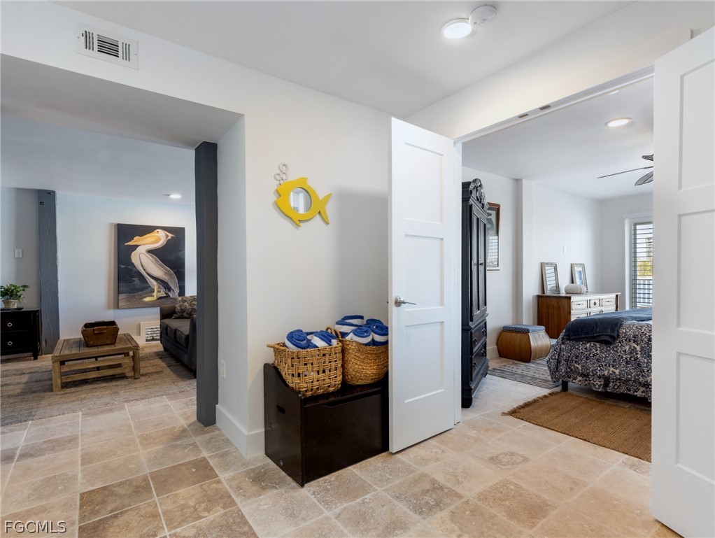 921 Prescott Street Fort Myers Beach, FL 33931 - Photo 30 of 50 a bedroom with furniture and a bed