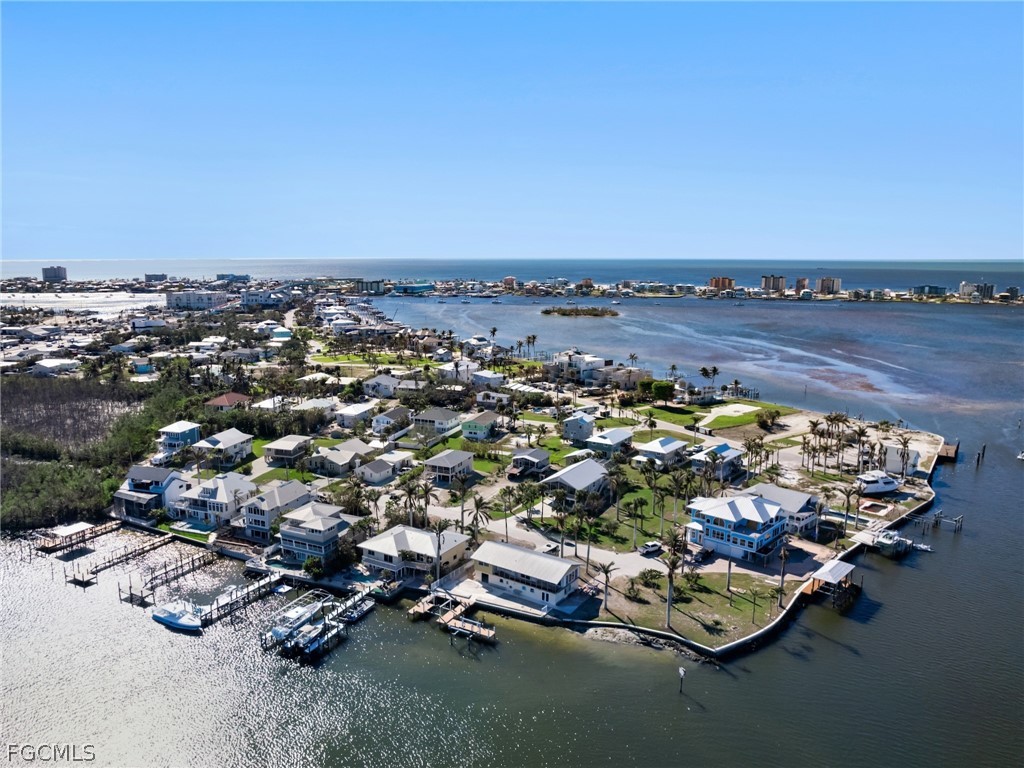 921 Prescott Street Fort Myers Beach, FL 33931 - Photo 4 of 50 an aerial view of a with parking space