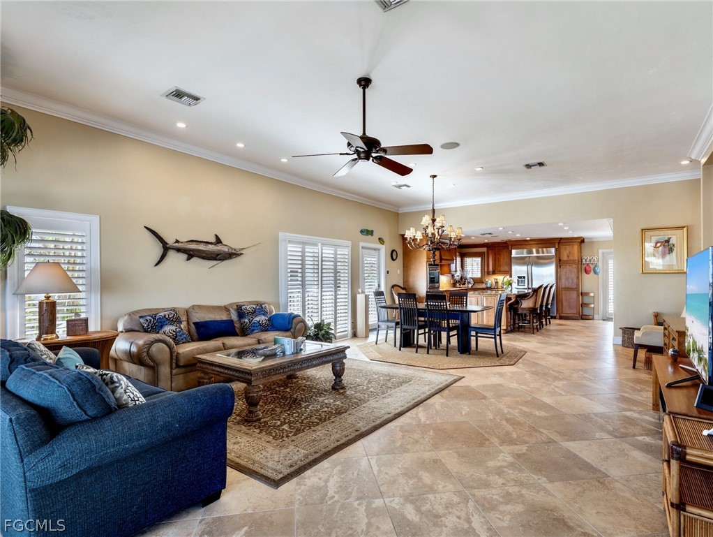 921 Prescott Street Fort Myers Beach, FL 33931 - Photo 7 of 50 a living room with furniture and a dining table