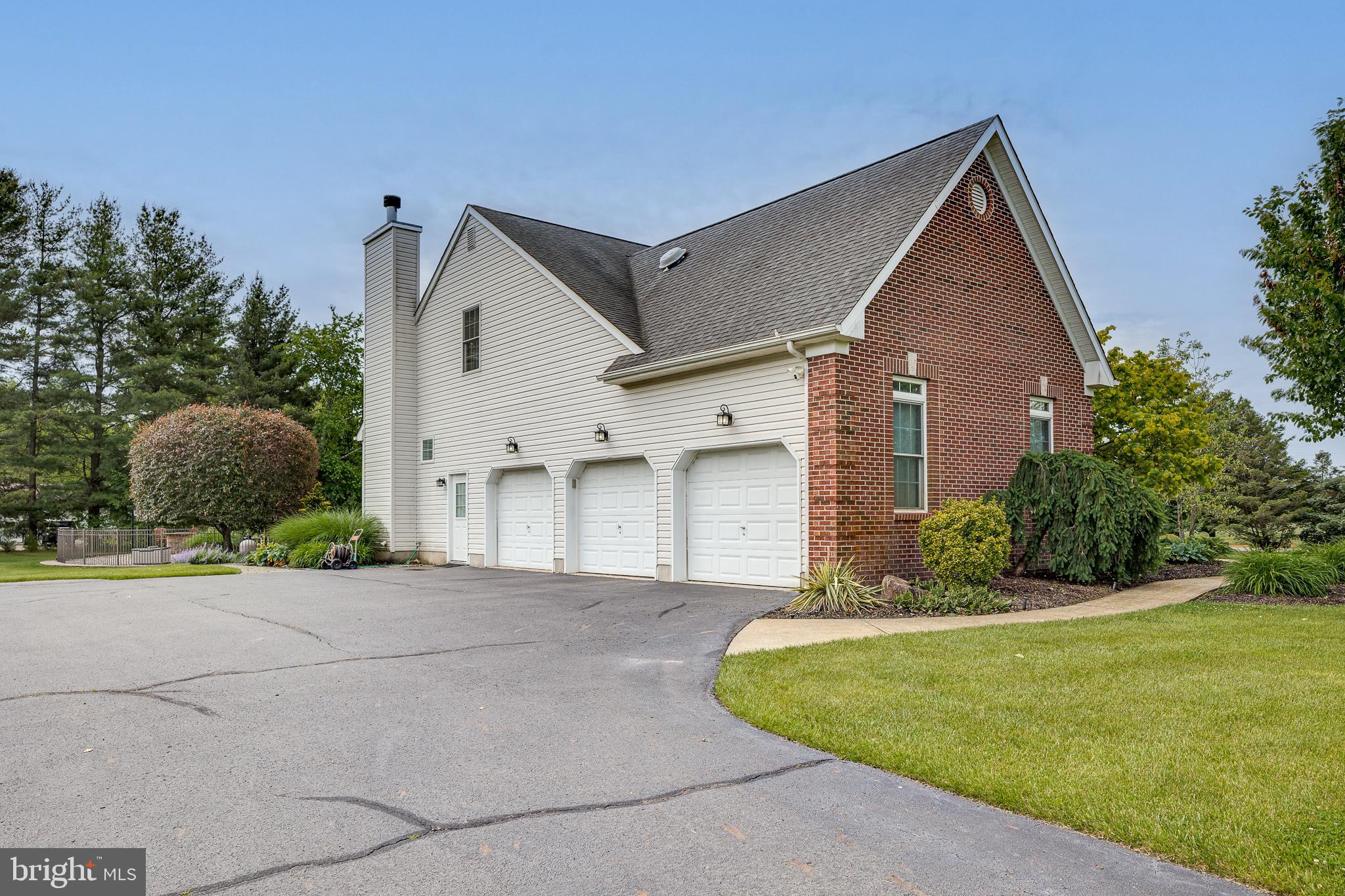 2 Dellaira Court Wrightstown, NJ 08562 - Photo 64 of 93 a front view of a house with a yard and garage