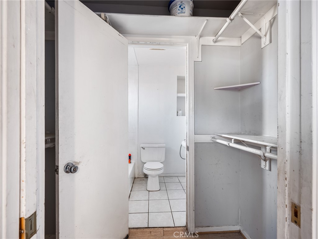 16003 Chestnut Street Hesperia, CA 92345 - Photo 19 of 28 a bathroom with a toilet and a shower