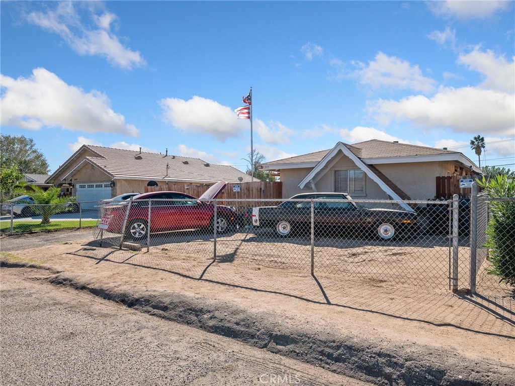 16003 Chestnut Street Hesperia, CA 92345 - Photo 27 of 28 a view of a house with wooden fence