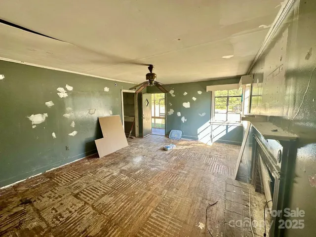 a bedroom with a bed and a large mirror on the dresser