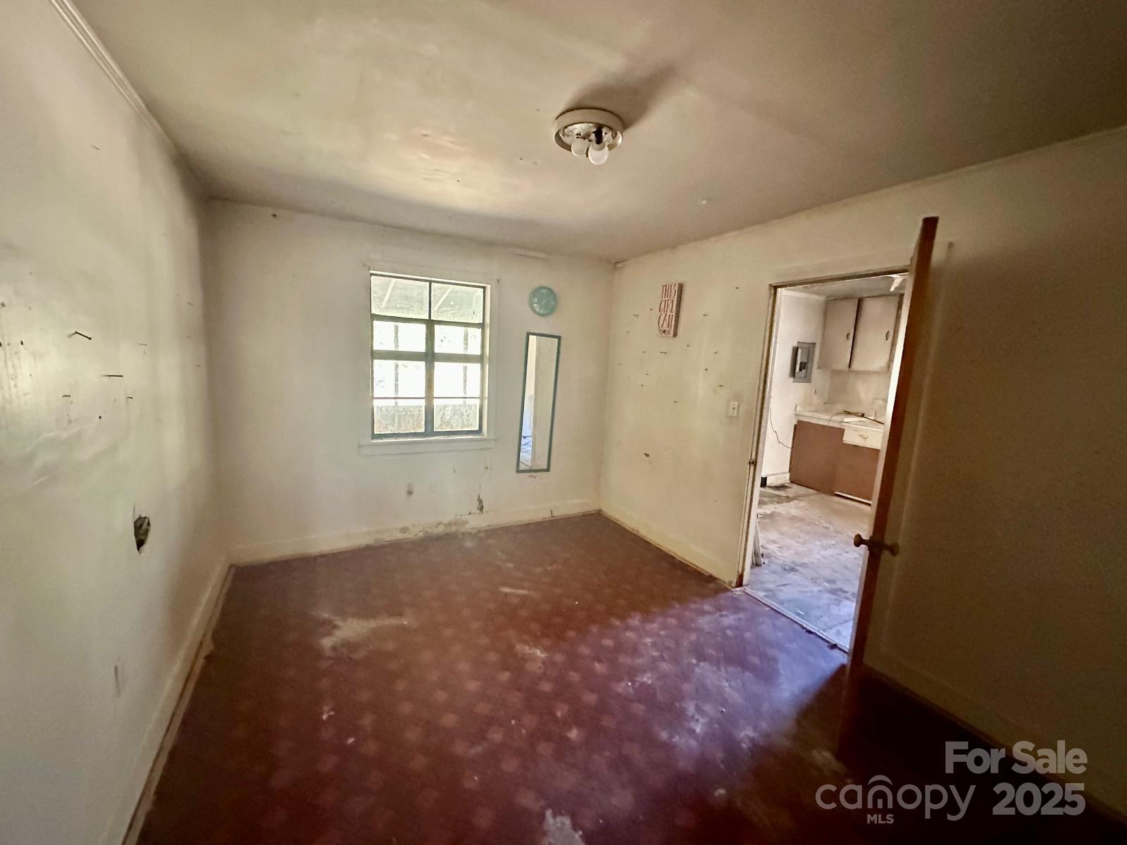 1016 East Arch Street Lancaster, SC 29720 - Photo 18 of 28 an empty room with windows