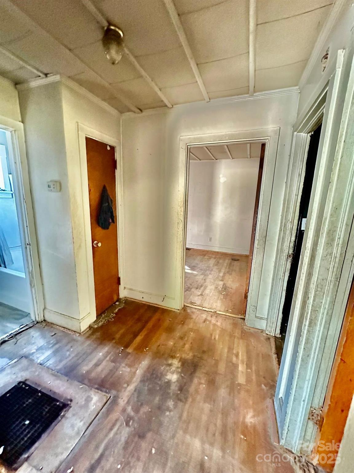 1016 East Arch Street Lancaster, SC 29720 - Photo 24 of 28 a view of a hallway with wooden floor and door