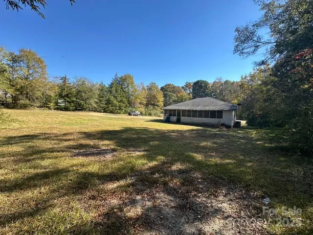 a view of a field with an ocean