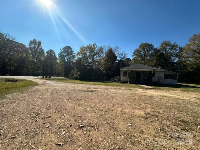 a house with trees in the background