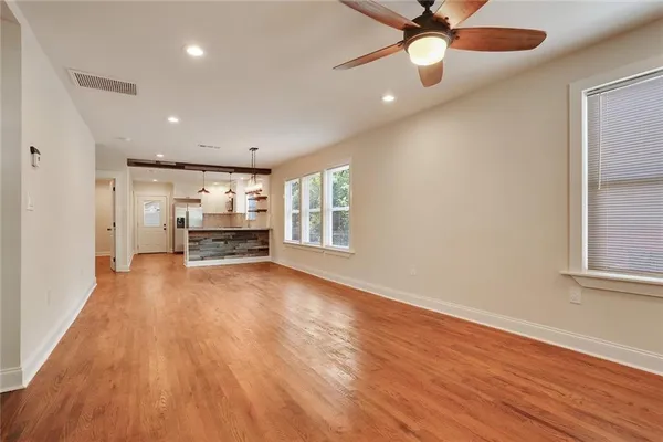 a view of kitchen with sink and wooden floor