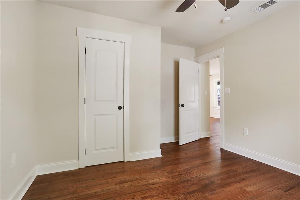 1060 Regent Street Southwest Atlanta, GA 30310 - Photo 20 of 24 a view of an empty room with wooden floor