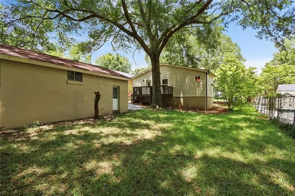 a backyard of a house with lots of green space