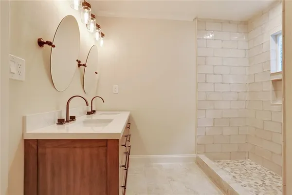a bathroom with a sink a shower
