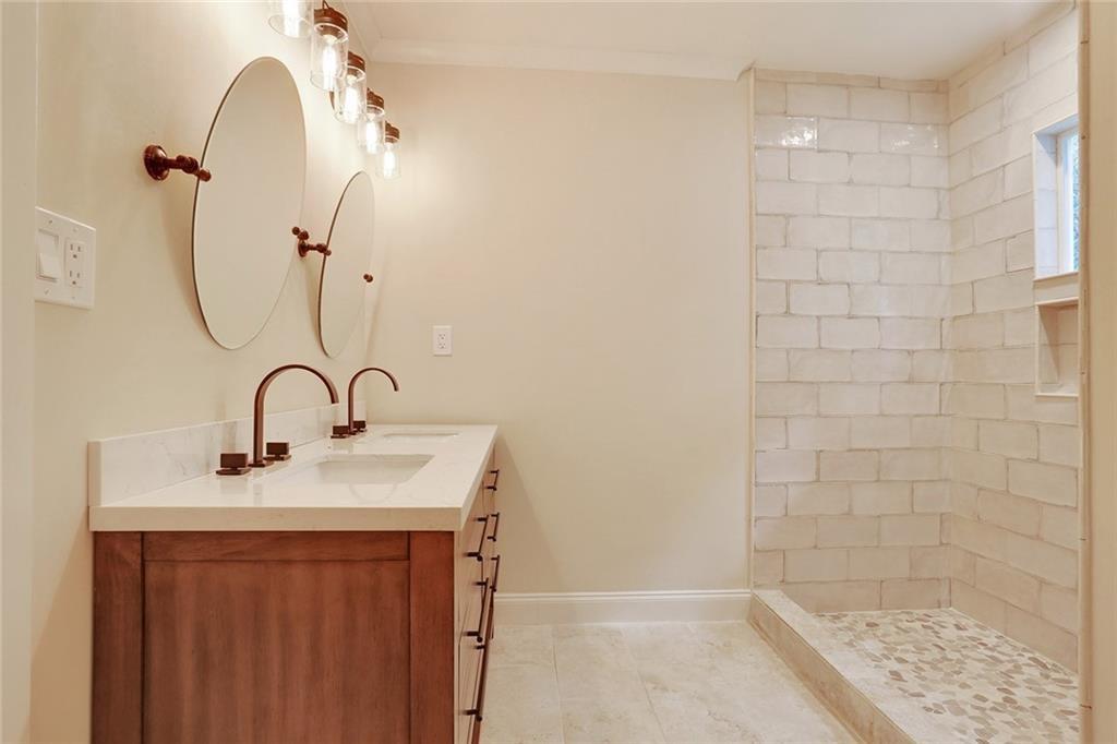 1060 Regent Street Southwest Atlanta, GA 30310 - Photo 6 of 24 a bathroom with a sink a shower