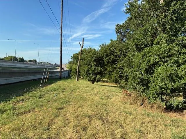 a view of a lake with a yard