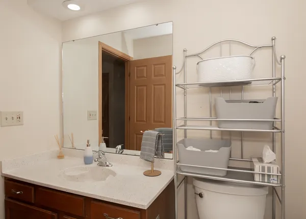 a bathroom with a sink and a mirror
