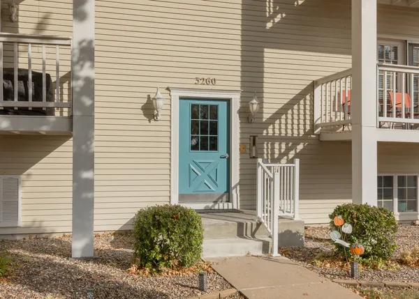 a view of a house with a chair and table chair