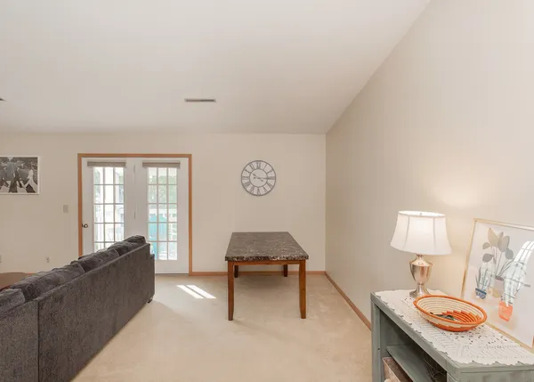 a living room with a couch and a table