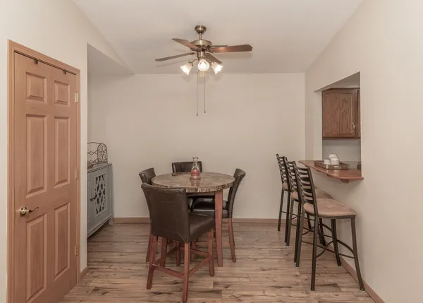 a view of a dining room with furniture and chandelier