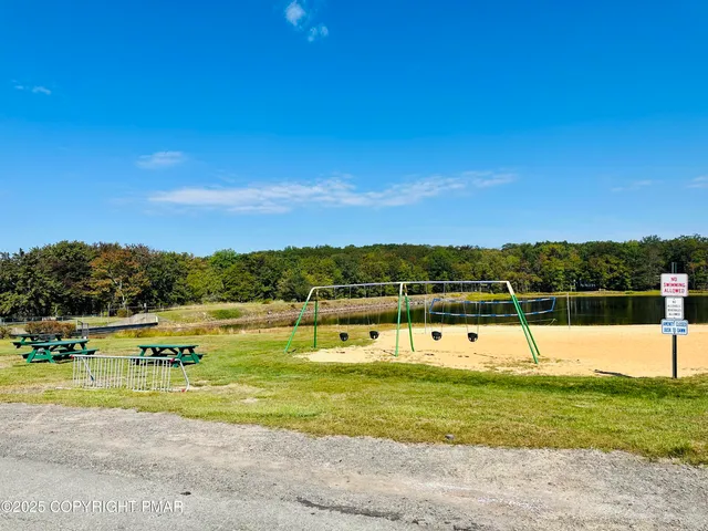 a view of a swimming pool with an ocean view