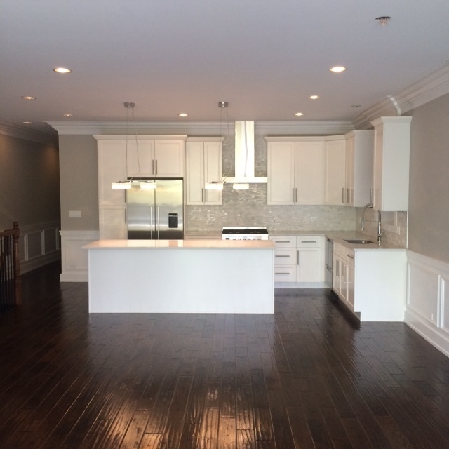 Undisclosed Address Chicago, IL 60608 - Photo 2 of 5 a large kitchen with stainless steel appliances granite countertop a stove a sink and a refrigerator