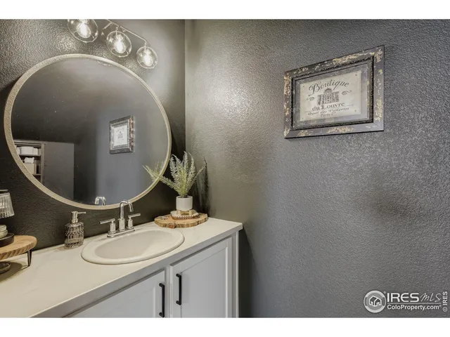 a bathroom with a sink and mirror