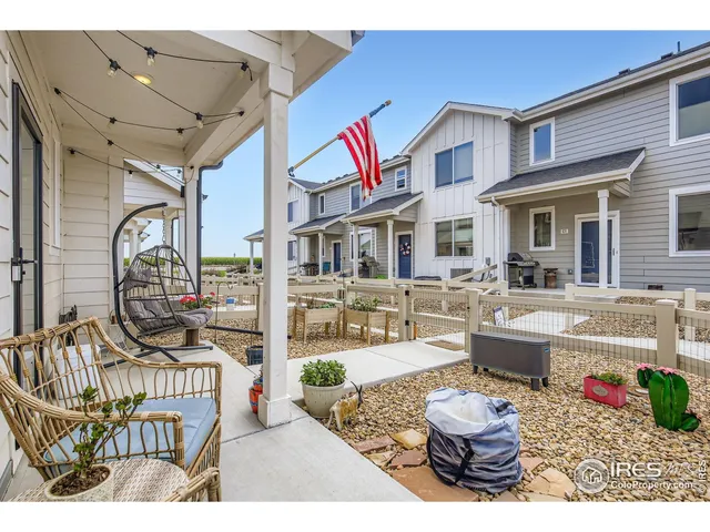 a front view of a house with outdoor seating