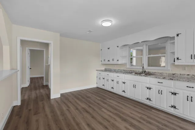 a kitchen with a sink and cabinets