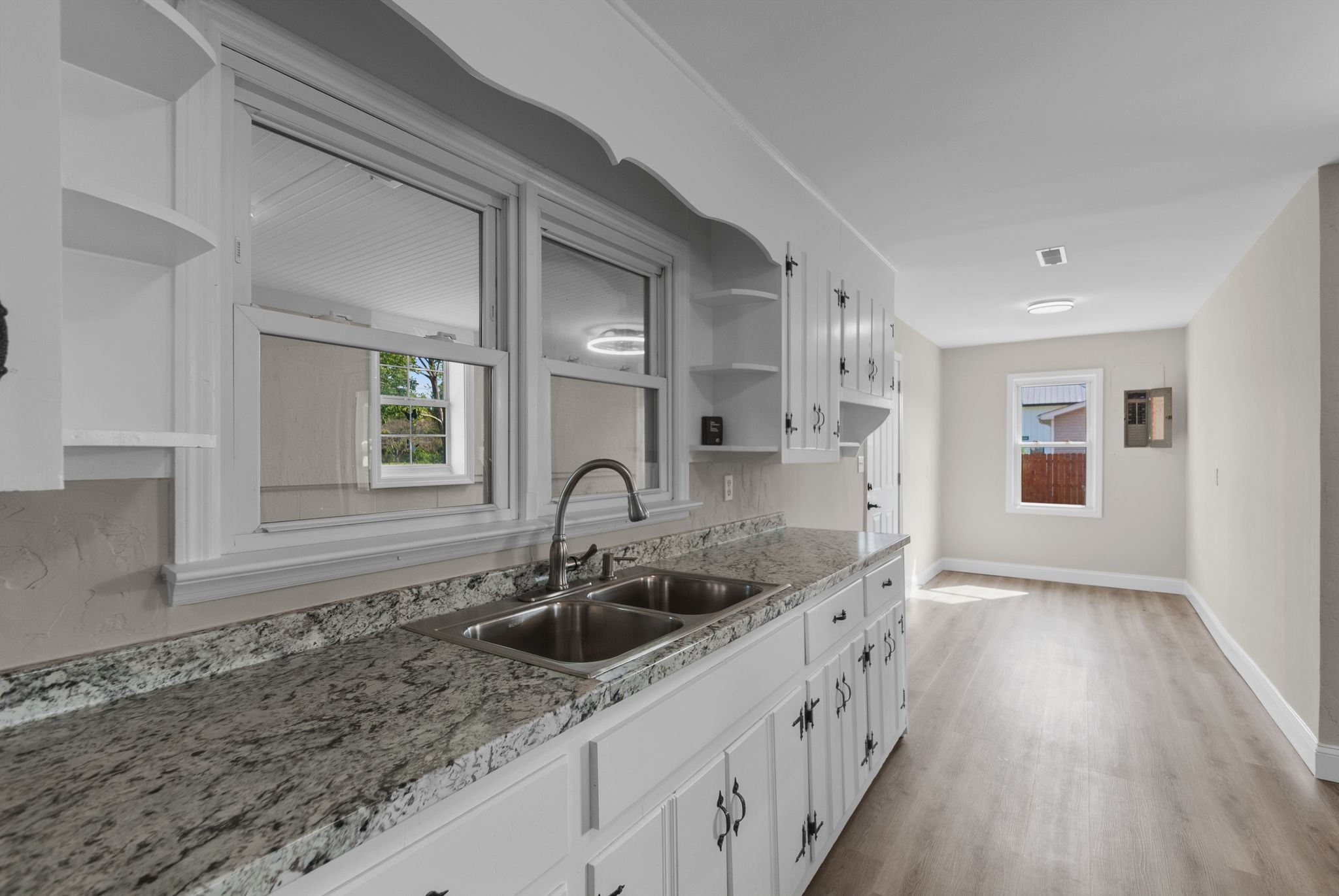 731 Smith Avenue Hohenwald, TN 38462 - Photo 20 of 28 a kitchen with a sink and cabinets