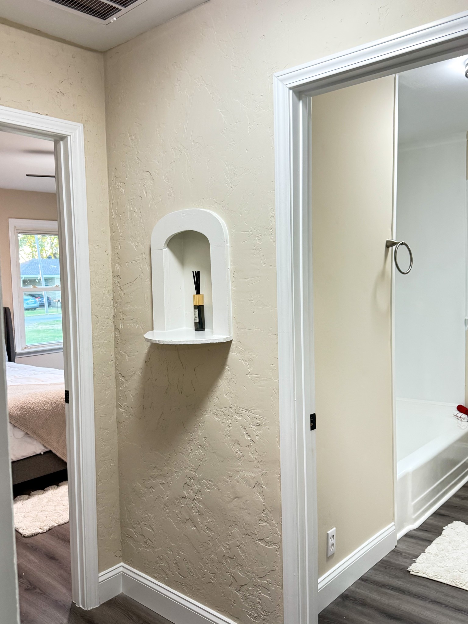 731 Smith Avenue Hohenwald, TN 38462 - Photo 22 of 28 a view of a bedroom from a hallway