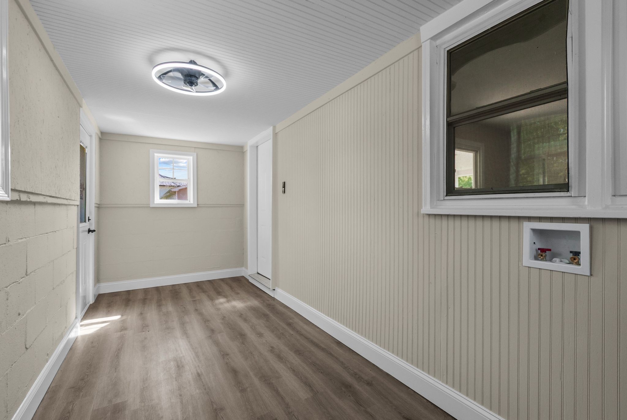 731 Smith Avenue Hohenwald, TN 38462 - Photo 25 of 28 a view of an empty room with wooden floor and a window
